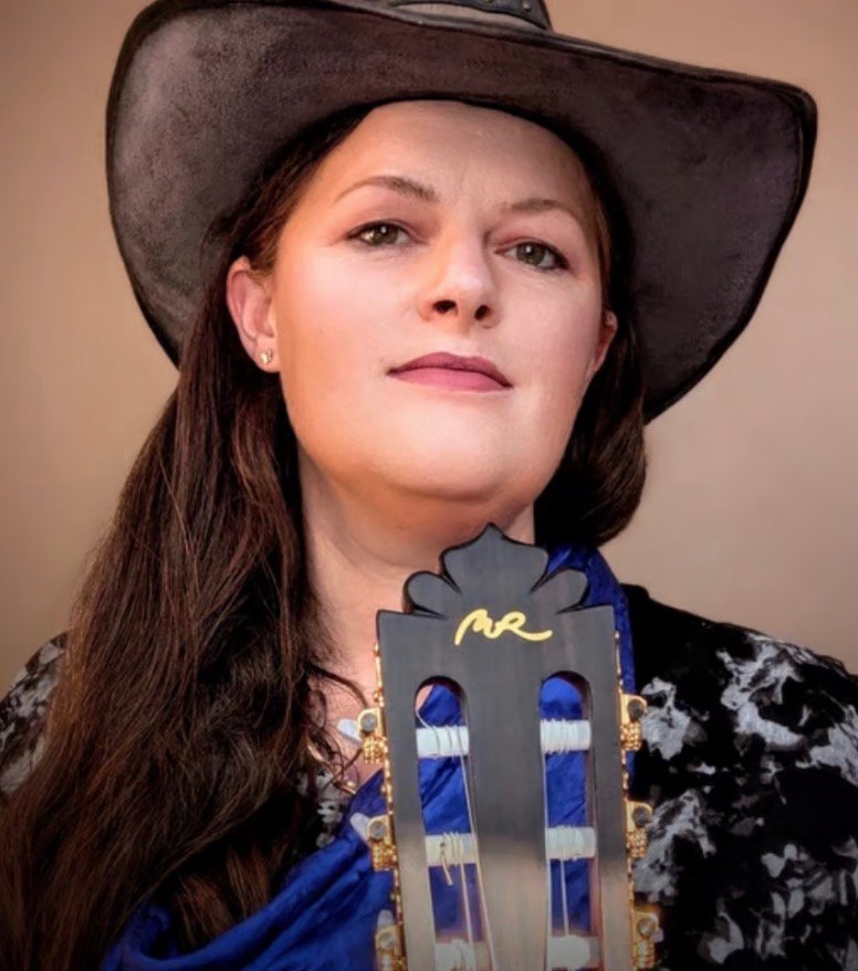 Kristen J. Lloyd, Northern Utah singer-songwriter, playing acoustic guitar